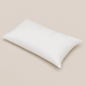 Funda de almohada desechable blanca de 40x100 cm sobre superficie lisa, ideal para uso profesional.