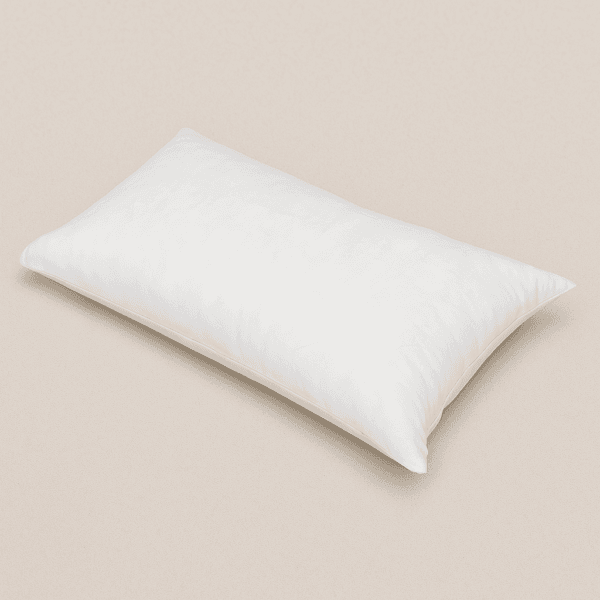 Funda de almohada desechable blanca de 40x100 cm sobre superficie lisa, ideal para uso profesional.
